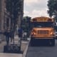 Yellow School bus on busy city street