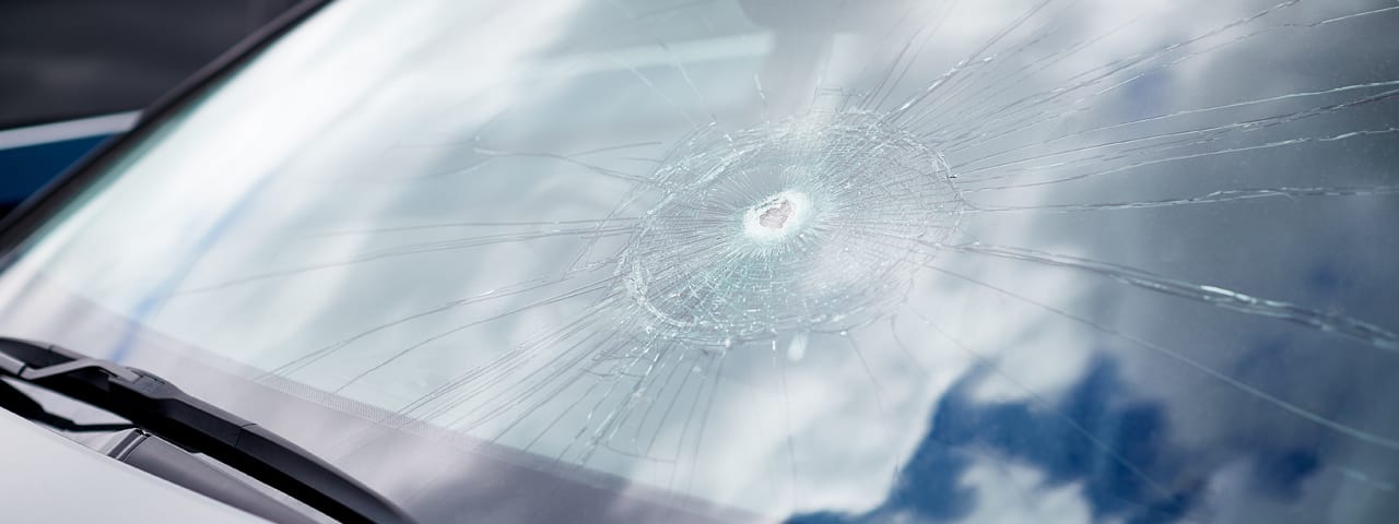 damaged windshield from a rock needing to put in an auto glass claim